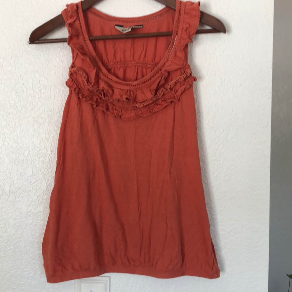 Orange ruffled racer-back blouse